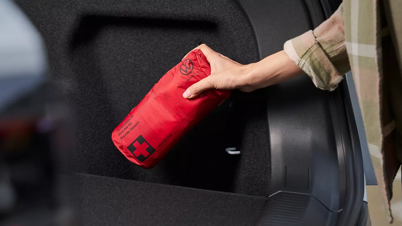 Someone holding a breakdown assistance safety kit by Volkswagen Accessories