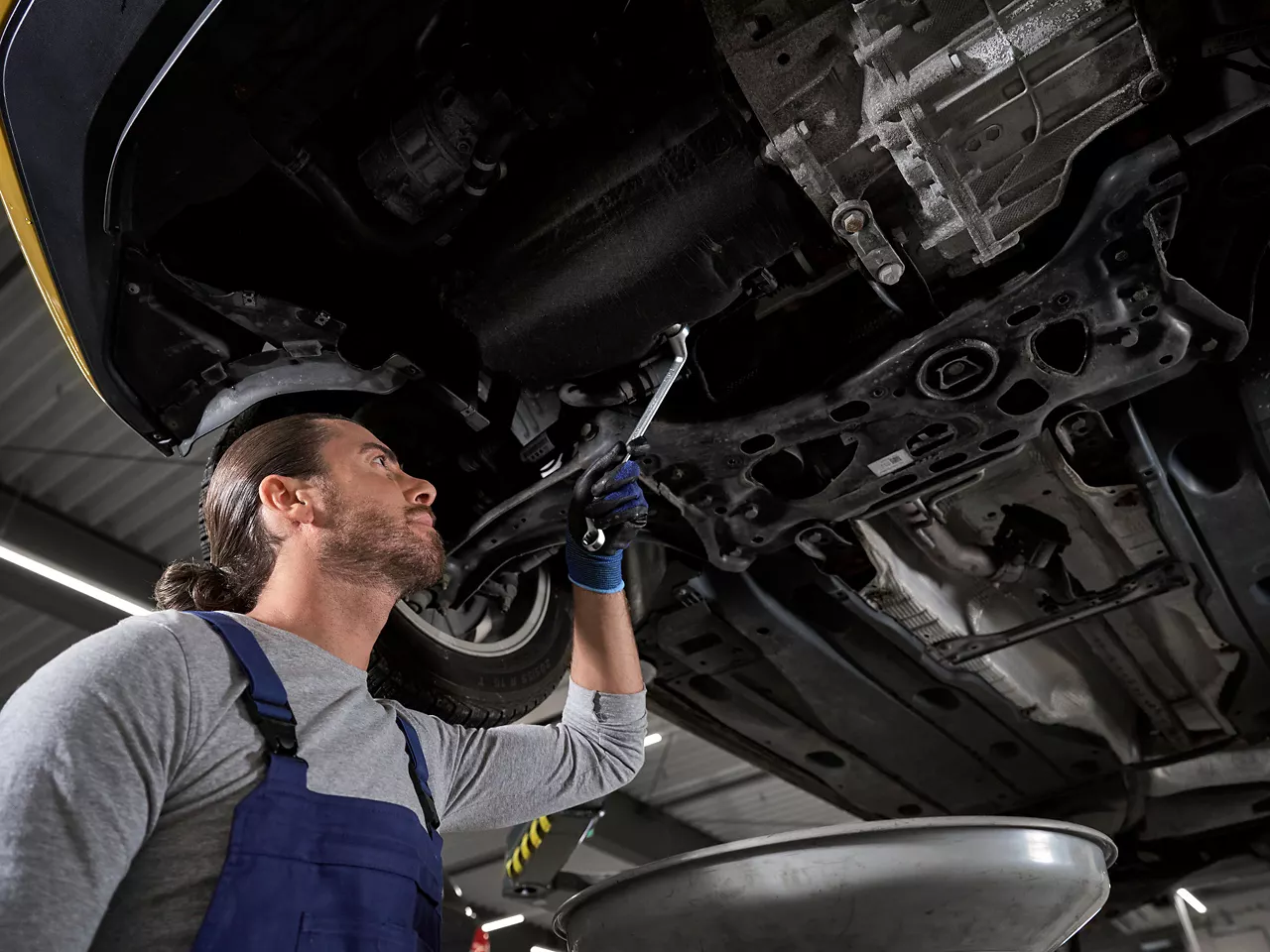 A Volkswagen technician carrying out an Oil Change Service