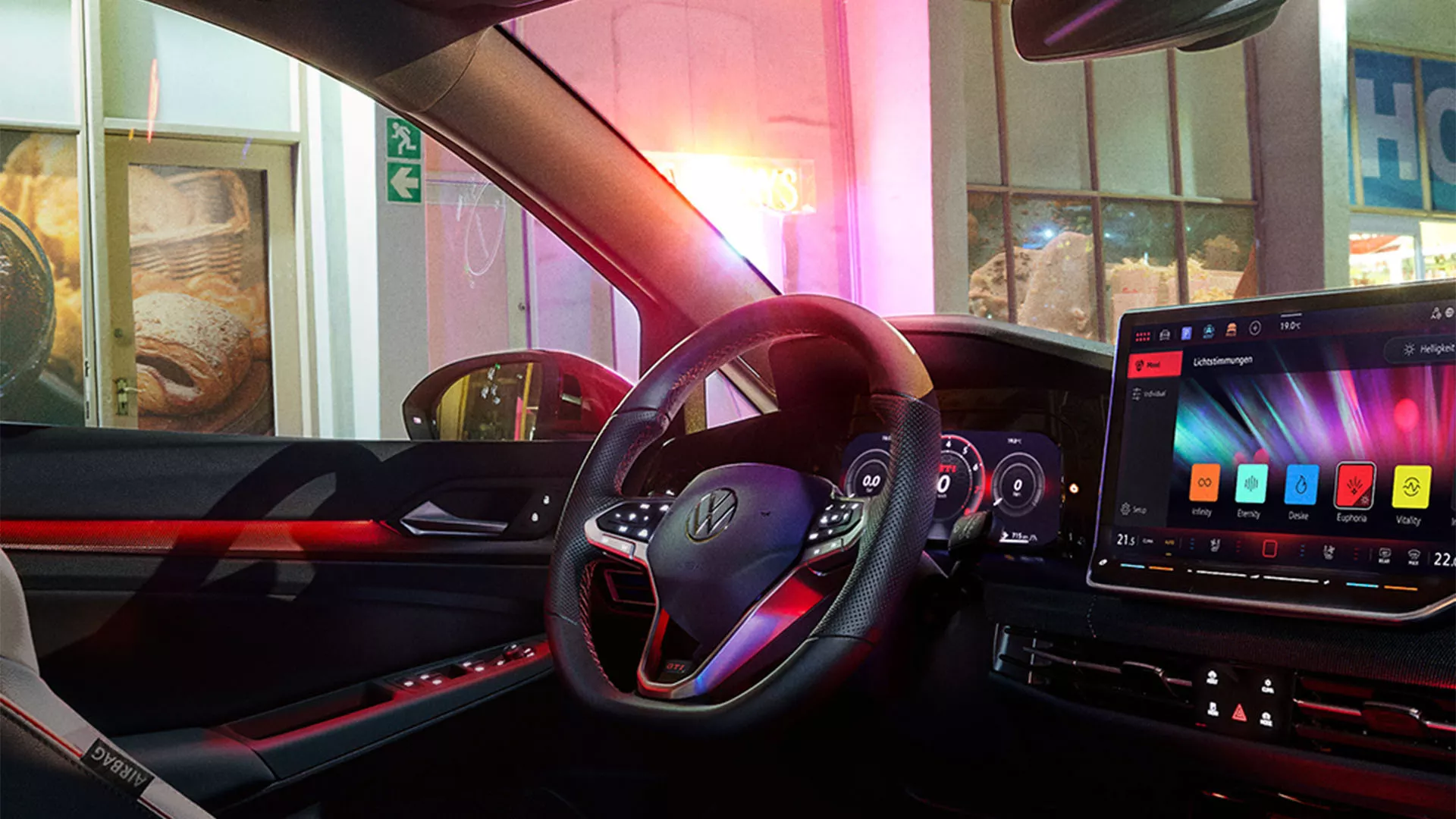 Interior view of the VW Golf with view of the steering wheel and cockpit from the driver's seat.