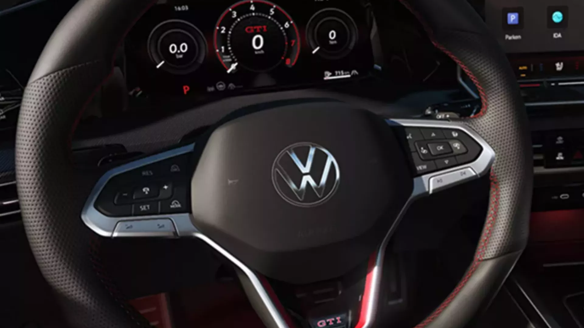 Interior view of the VW Golf with view of the steering wheel and cockpit from the driver's seat.