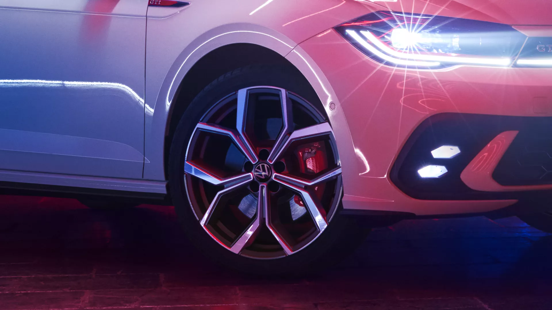 Close-up of a rim of a white VW Polo GTI.