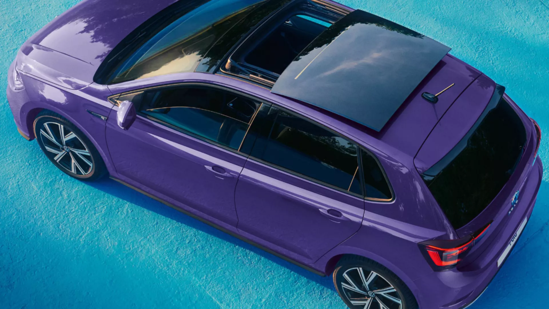 View from above of a purple VW Polo with optional panoramic sliding roof.
