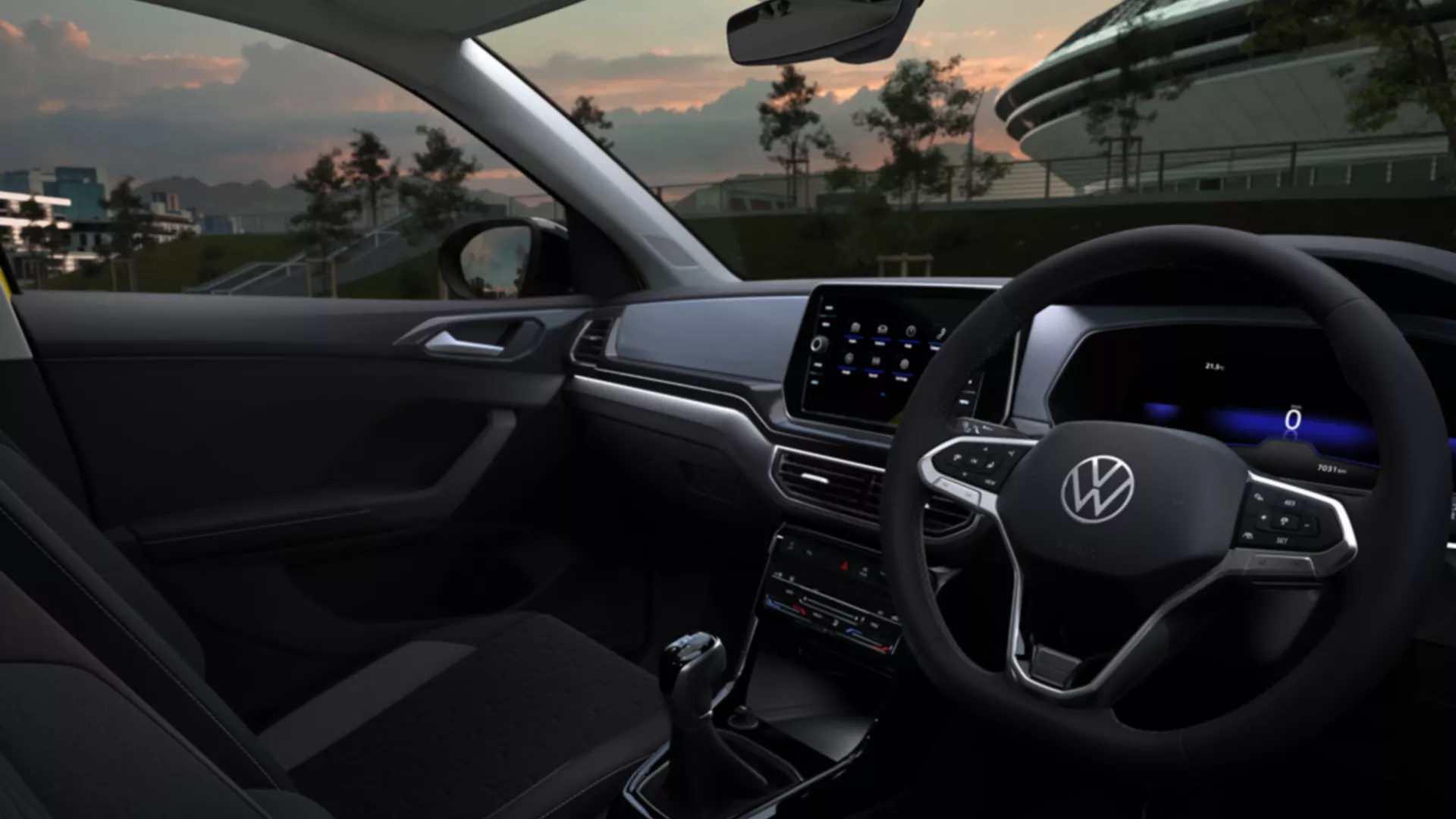 Detailed view of the cockpit of the VW T-Cross at night with focus on the white ambient lighting