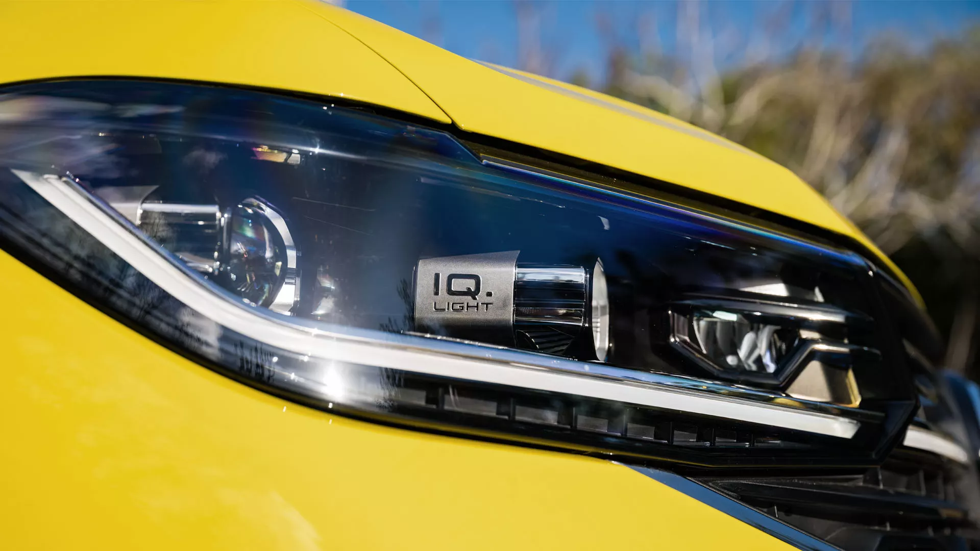 Detailed view of the front headlights with visible IQ. lettering.