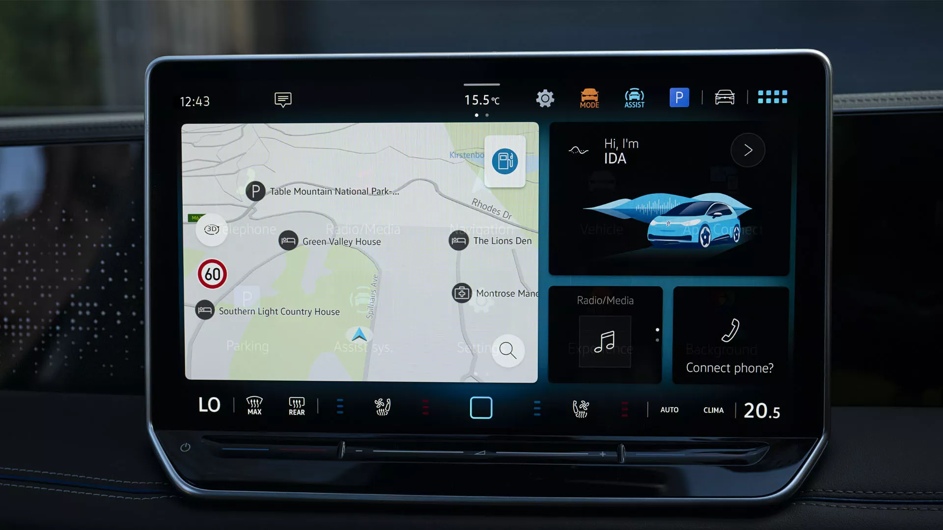 A young woman on the driver seat of her VW Tiguan interacting with the digital voice assistant