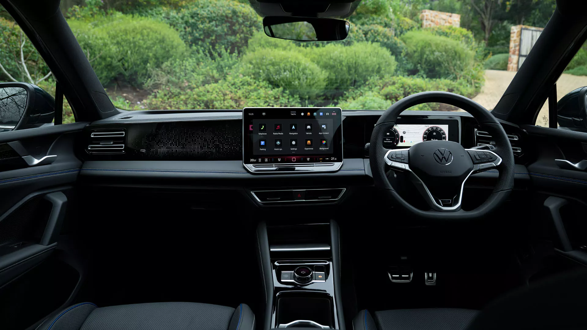 Interior shot of the VW Tiguan. A woman gets in on the driver side.